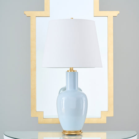 Leighton Sky Table Lamp in front of gold mirror