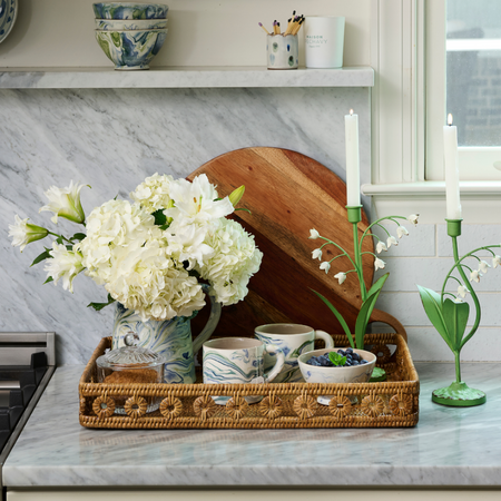 Lily of the Valley Taper Holders styled with white hydrangeas in basket tray