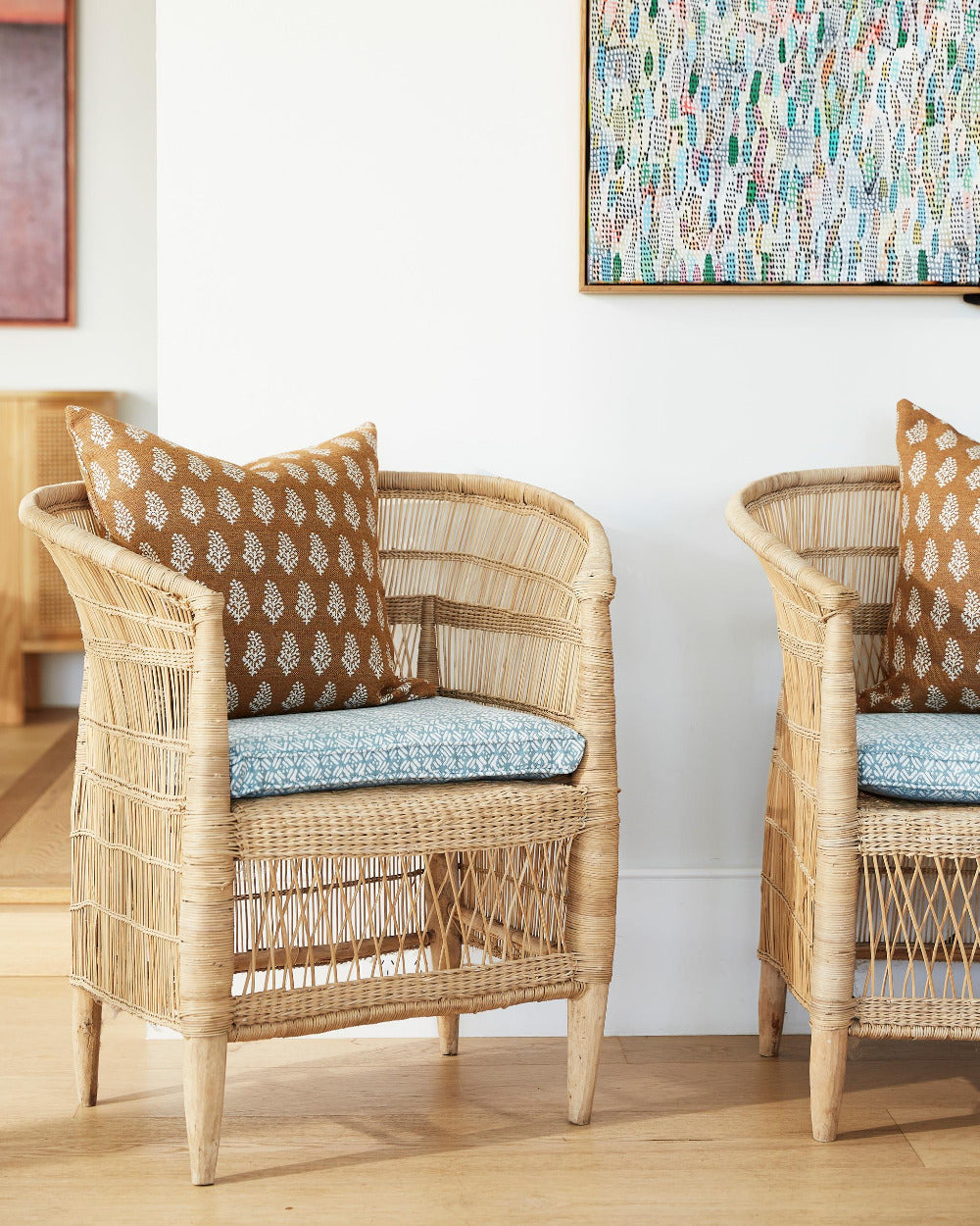 Lucknow Rattan Outdoor Pillow Cover styled in wicker chair