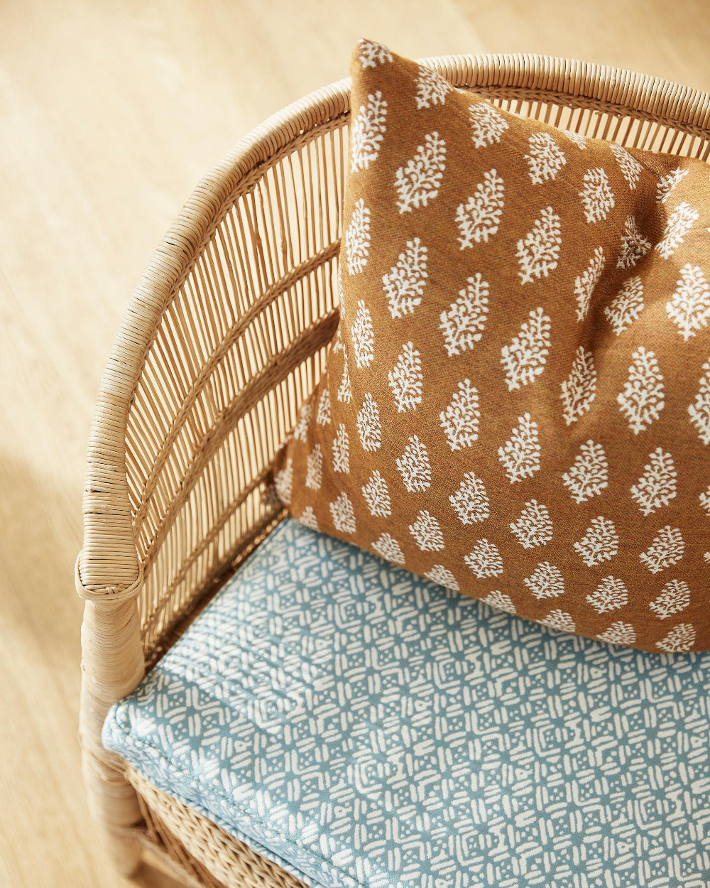 Lucknow Rattan Outdoor Sunbrella Pillow Cover in chair