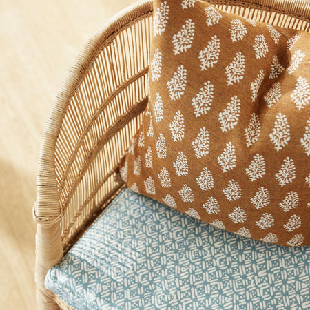 Lucknow Rattan Outdoor Sunbrella Pillow Cover in chair