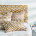 Lyon Saffron Lumbar Pillow Cover styled on bed