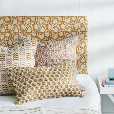 Lyon Saffron Lumbar Pillow Cover styled on bed