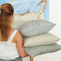 Malabar Celadon Pillow Cover stacked in arms - Walter G block print pillows