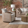 Mansfield Oatmeal Swivel Club Chair styled in brick loft space