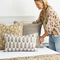 Marbella Saffron Pillow Cover on bed