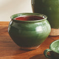Marcel Pot styled on wood table - Green Ceramic
