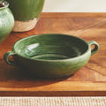 Marcel Shallow Green Ceramic Bowl styled on wood table
