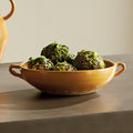 Marcel Yellow Green Ceramic Bowl styled with moss balls