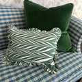 Moss Velvet Pillow styled with green chevron ruffle lumbar