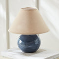 Mignon Blue Mini Lamp with linen shade on book