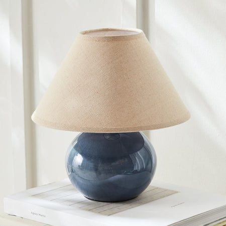 Mignon Blue Mini Lamp with linen shade on book