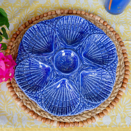 Nola Cobalt Oyster Plate on sunny dining table