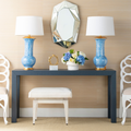 Parsons Navy Grasscloth Console styled with blue lamps and loop side chairs