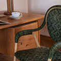 Portofino Green Woven Rattan Arm Chair styled at desk
