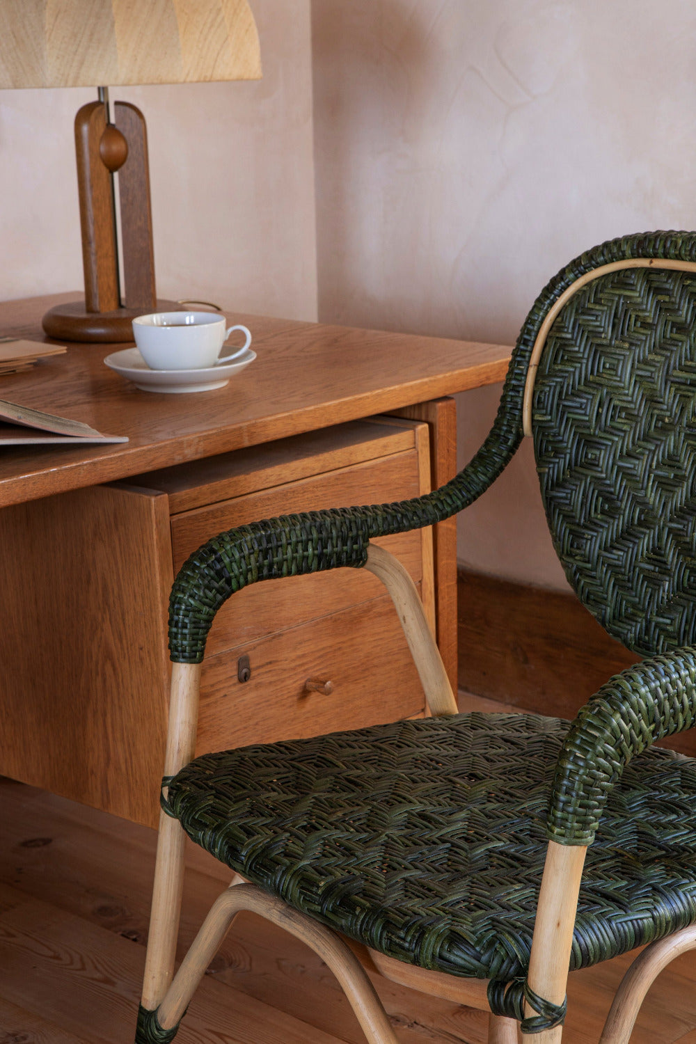 Portofino Green Woven Rattan Arm Chair styled at desk