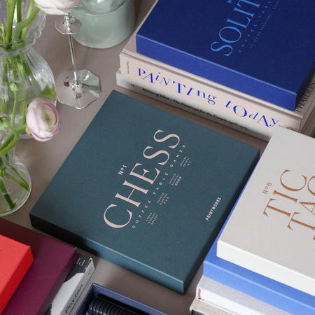 Classic Chess boxed game on coffee table