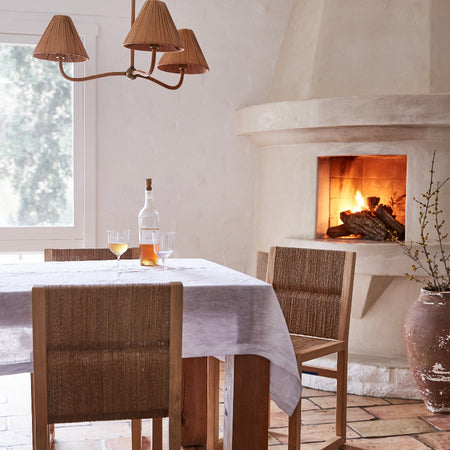 Delphine Chandelier styled in dining room with fireplace