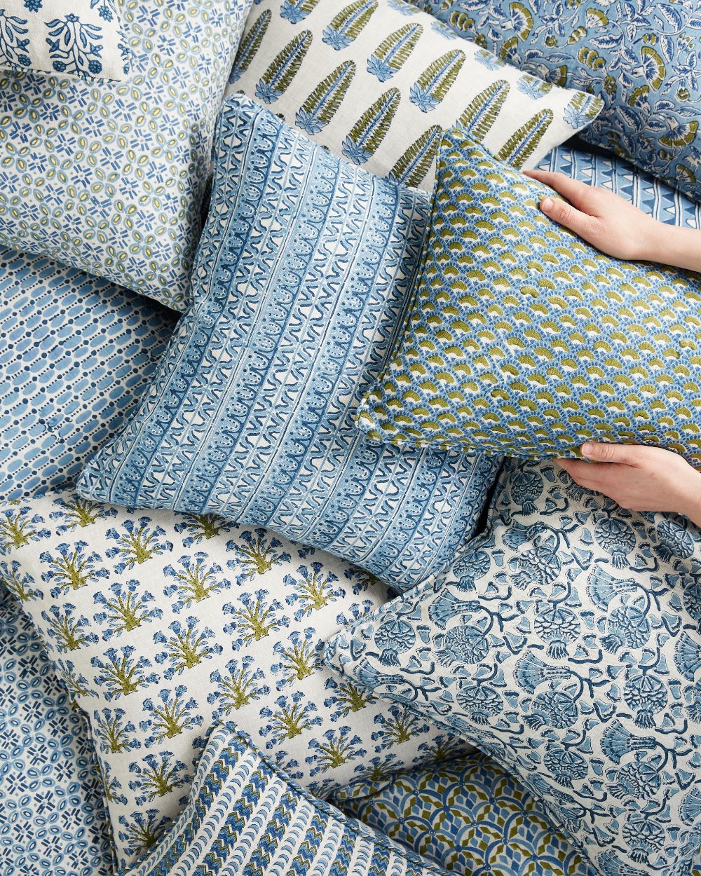 Samode Moss Azure Pillow Cover in pile of block print pillows
