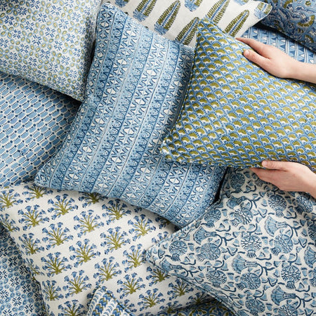 Samode Moss Azure Pillow Cover in pile of block print pillows
