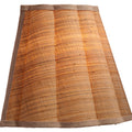 Scalloped Natural Raffia Wall Sconce illuminated