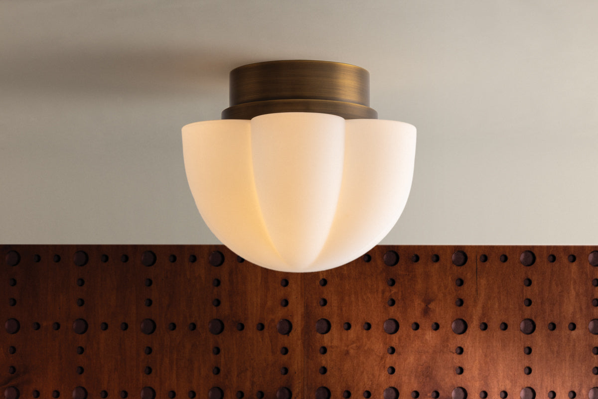 Seabrook Flush Mount - illuminated against wood all