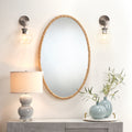 Simeon Braided Oval Mirror styled with pale blue lamp