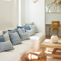 Simrane Azure Pillow Cover styled with Walter Blue pillows on white sofa
