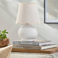 Skyler Mini Lamp on side table with stack of books