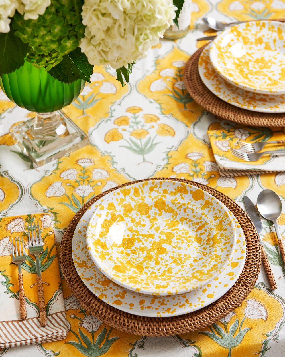 Sunny Days Napkin and Tablecloth styled with yellow splatter dinnerware