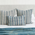 Tangier Denim Lumbar Pillow Cover styled on bed with Zanzibar Azure pillows