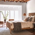 Textura Bed styled in bedroom with wood beams