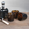 Tortoise Tumbler Glass Set styled with bottle