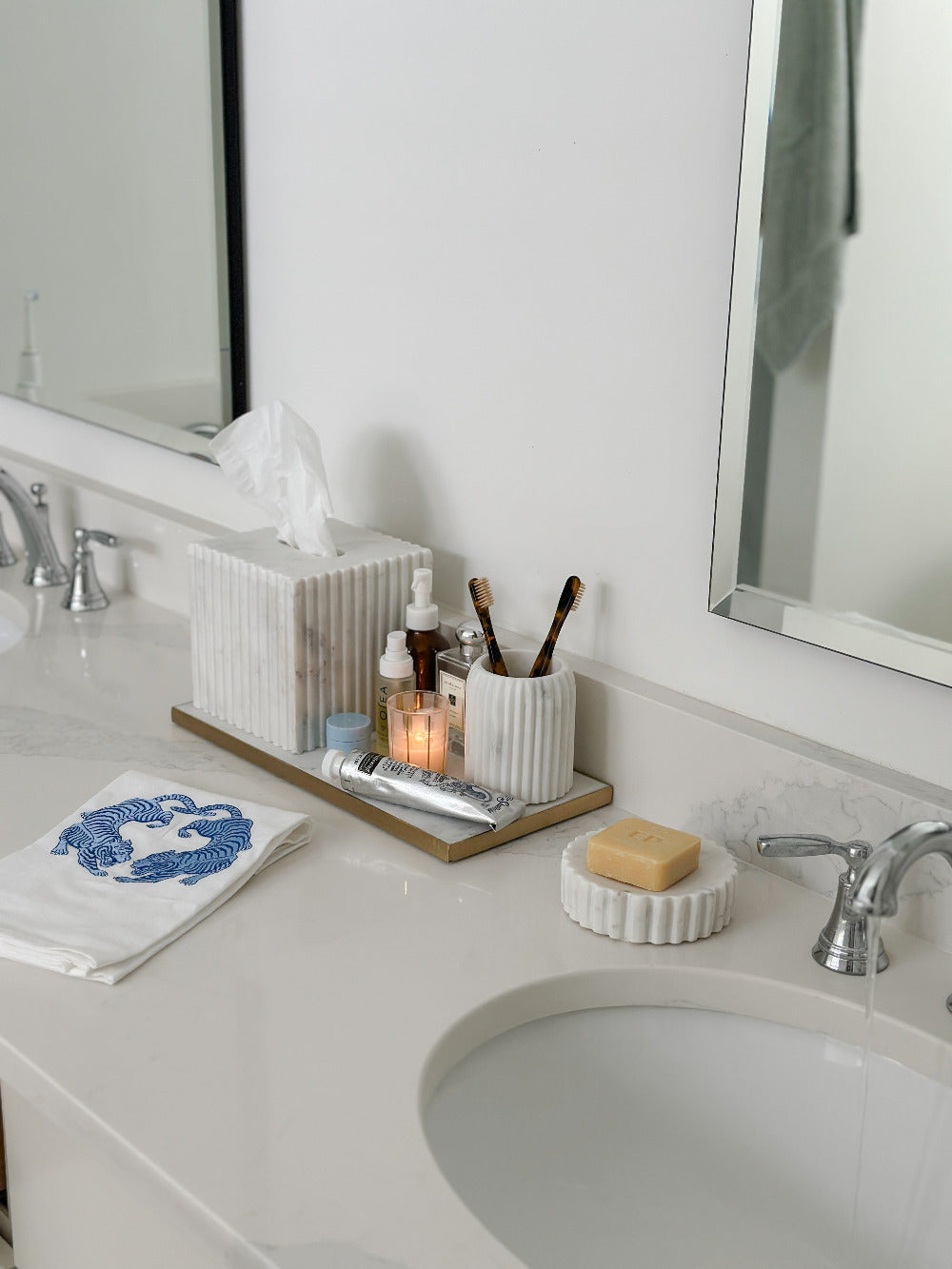 Twin Tigers hand towel styled in bathroom with marble accessories