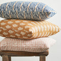 Walter G Sunbrella Rattan colorway outdoor pillow stack