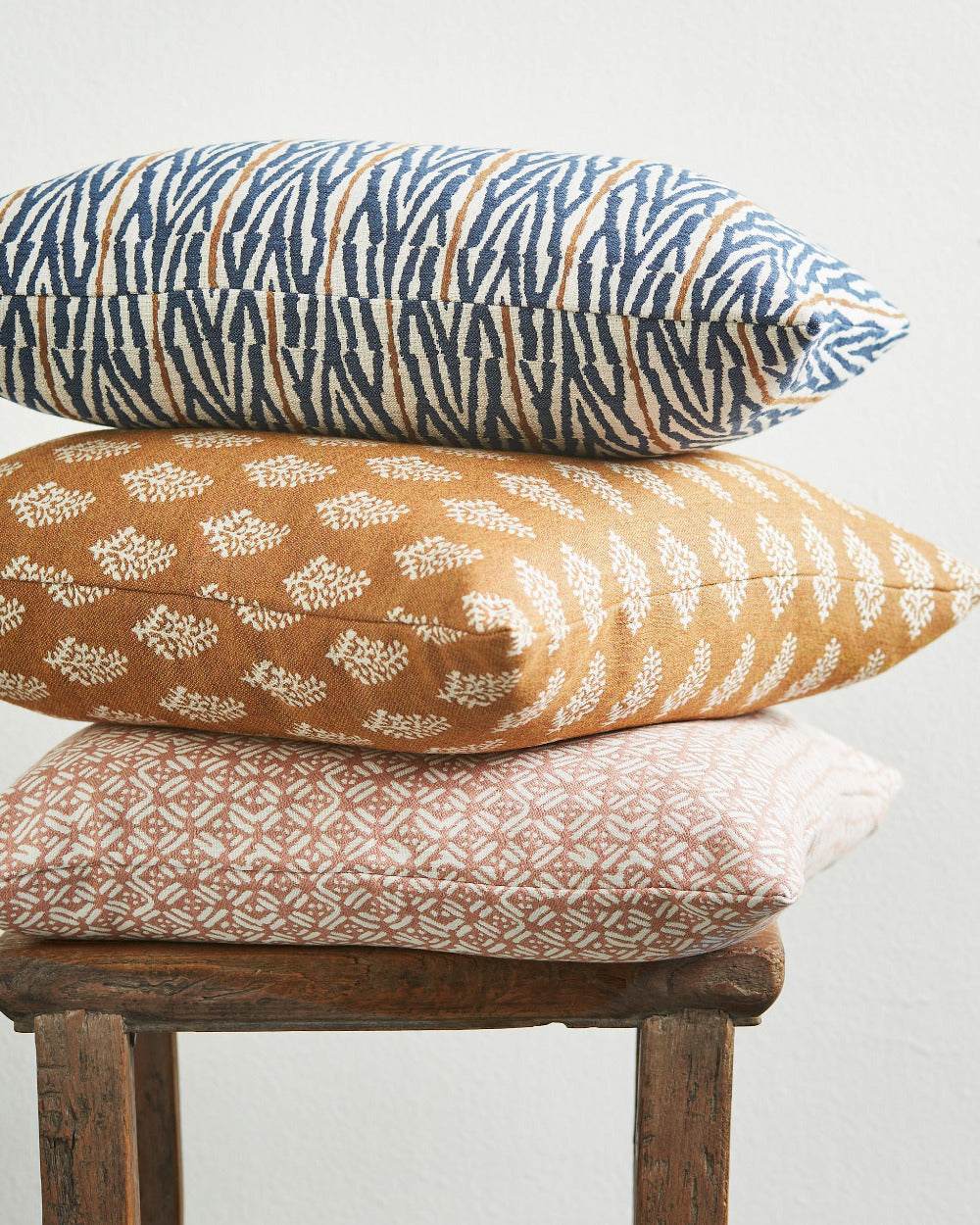 Walter G Sunbrella Rattan colorway outdoor pillow stack