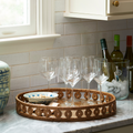 Menton Round Rattan Tray styled with wine glasses