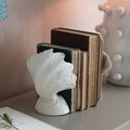White Shell Cast Iron Bookends styled with vintage books
