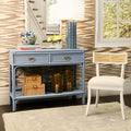 Fernandina Light Blue Rattan Console styled in wallpapered room