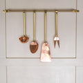 Copper Utensils on Brass Rod hanging 