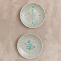Pair of Cruz Decorative Wall Plates on wall