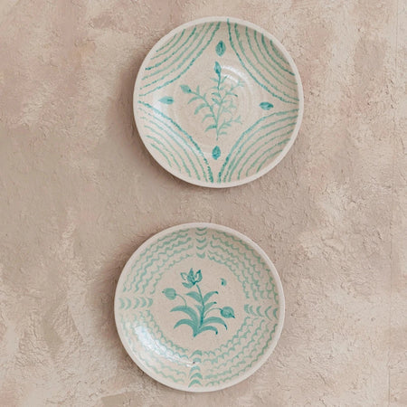Pair of Cruz Decorative Wall Plates on wall