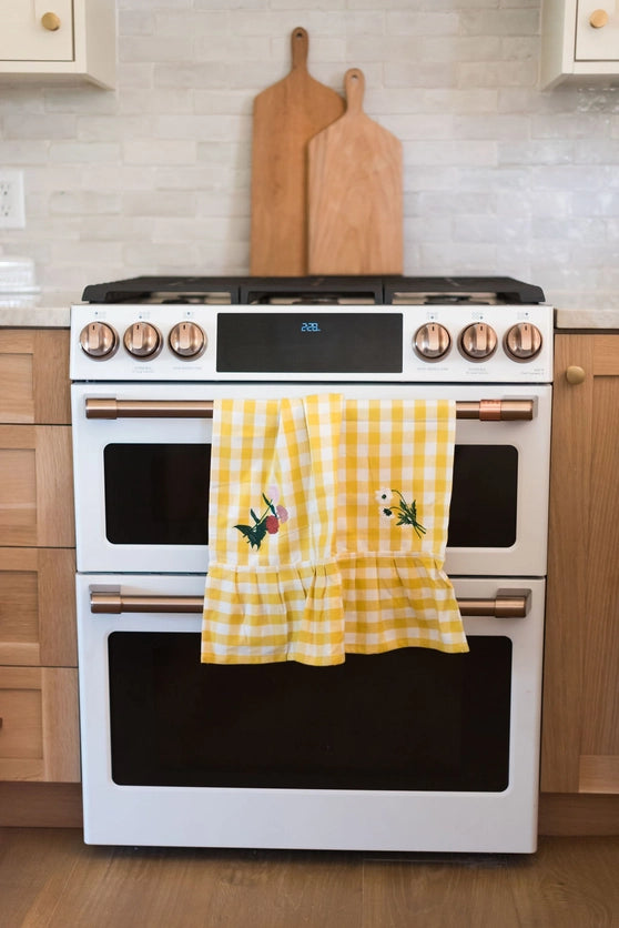Yellow Ruffle Gingham Dish Towel with embroidered flowers in kitchen