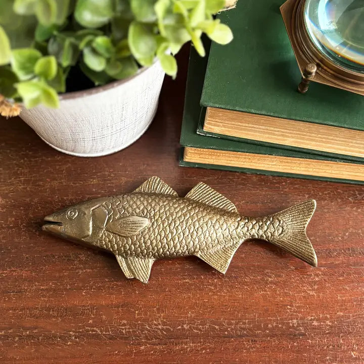 Gold Bass Fish Paper Weight on desk