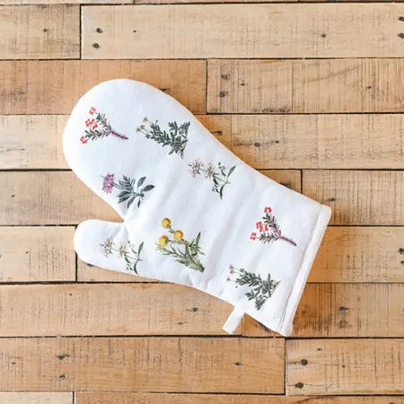Flora Oven Mitt on wood surface