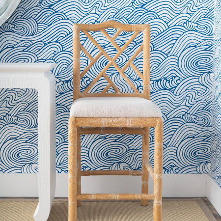 Hayden Natural Counter Stool with blue wallpaper background