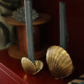 Brass Shell Candle Holders styled with blue candles