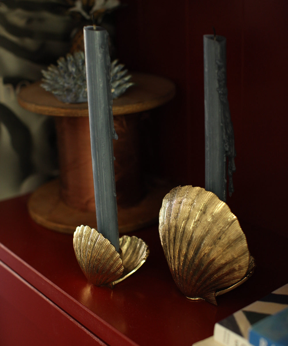 Brass Shell Candle Holders styled with blue candles