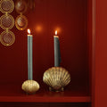 Brass Scallop Shell Candle Holders with lit blue candles