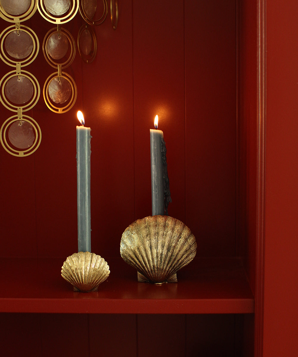 Brass Scallop Shell Candle Holders with lit blue candles